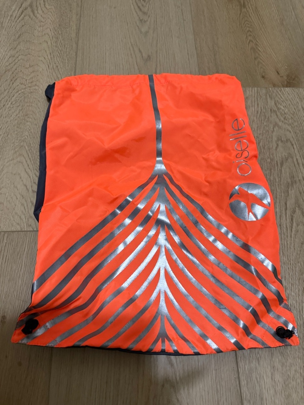 Oiselle Neon Orange Drawstring Pack with Reflective Stripes